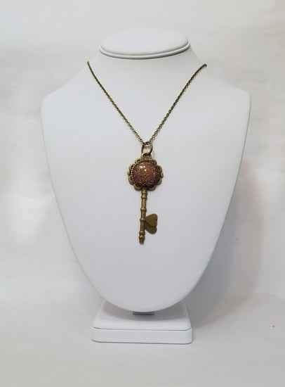 Antiqued Brass  Flowered Skeleton Key pendant necklace with Fused Glass Orange Dichroic cabochon on 24 inch brass plated chain jewelry seeds glassworks seedsglassworks