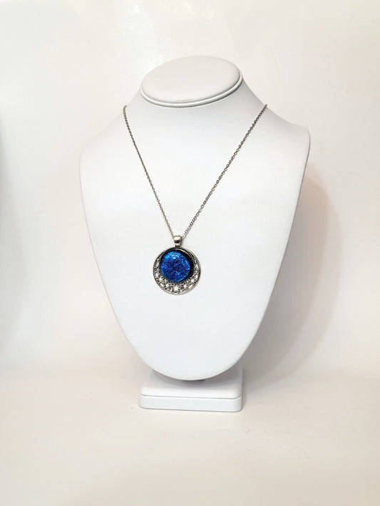 Silver tone Moon and Stars Celestial Pendant Necklace with Royal Blue dichroic glass cabochon on a 20 inch steel metal chain. seeds glassworks seedsglassworks