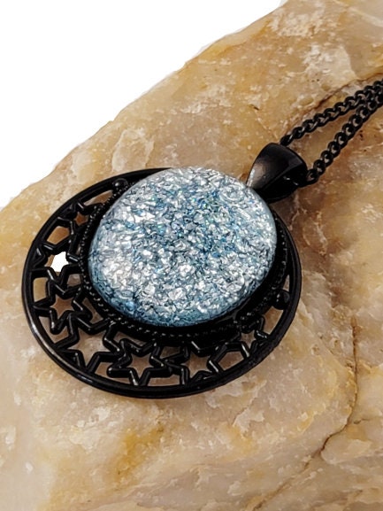 Black Moon and Stars Celestial Pendant Necklace with Silver dichroic glass cabochon on a 20 inch black metal chain. seeds glassworks seedsglassworks