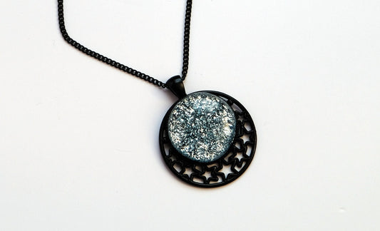 Black Moon and Stars Celestial Pendant Necklace with Silver dichroic glass cabochon on a 20 inch black metal chain. seeds glassworks seedsglassworks