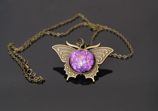 Butterfly pendant necklace, brass tone with dark purple dichroic fused glass center stone on a 20 inch brass tone chain