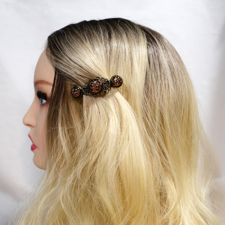 Barrette pair, bronze flowers with dark orange dichroic fused glass cabochons, french clip, 2 1/4 inches