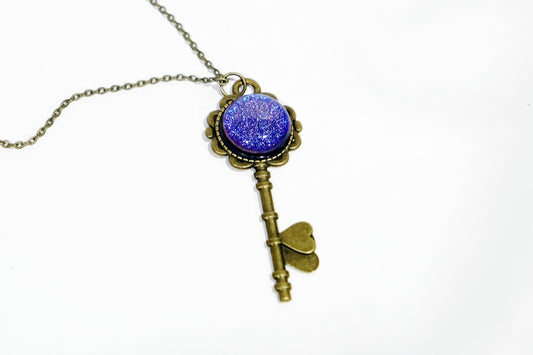 Antiqued Brass  Flowered Skeleton Key pendant necklace with Fused Glass Purple Dichroic cabochon on 24 inch brass plated chain jewelry seeds glassworks seedsglassworks