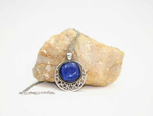 Silver tone Moon and Stars Celestial Pendant Necklace with Royal Blue dichroic glass cabochon on a 20 inch steel metal chain. seeds glassworks seedsglassworks