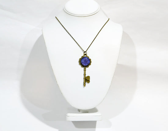 Antiqued Brass  Flowered Skeleton Key pendant necklace with Fused Glass Purple Dichroic cabochon on 24 inch brass plated chain jewelry seeds glassworks seedsglassworks