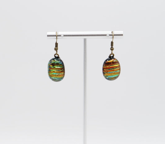 Dichroic rainbow stripes fused glass pierced dangling earrings on antiqued brass tone french wires. Approx 1.5 inches total length seeds glassworks seedsglassworks