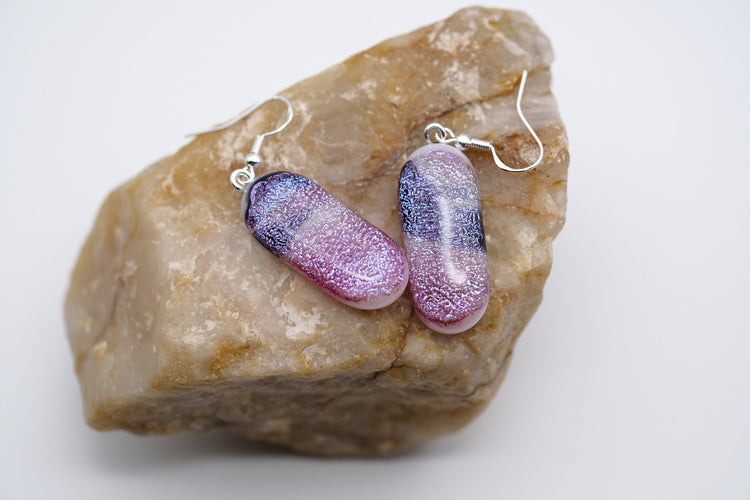 Dichroic pink, purple and white sparkling fused glass pierced dangling earrings on silver french wires. Approx 2 inches total length seeds glassworks seedsglasswork