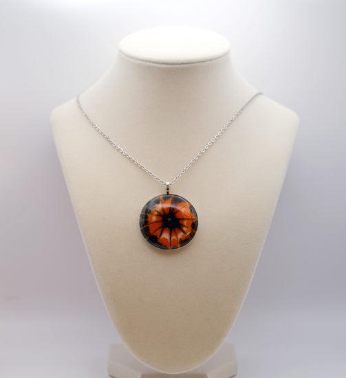 Tie Dye look Halloween fused glass pendant necklace jewelry in black, white and orange on 20 inch steel chain seeds glassworks seedsglassworks