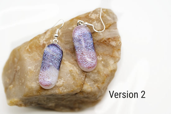 Dichroic pink, purple and white sparkling fused glass pierced dangling earrings on silver french wires. Approx 2 inches total length seeds glassworks seedsglasswork