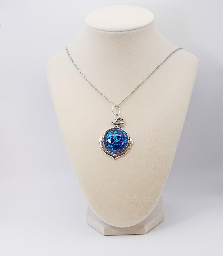 Silver Anchor pendant necklace, with blue and black sparkling dichroic fused glass center stone on a 20 inch steel chain seeds glassworks seedsglassworks