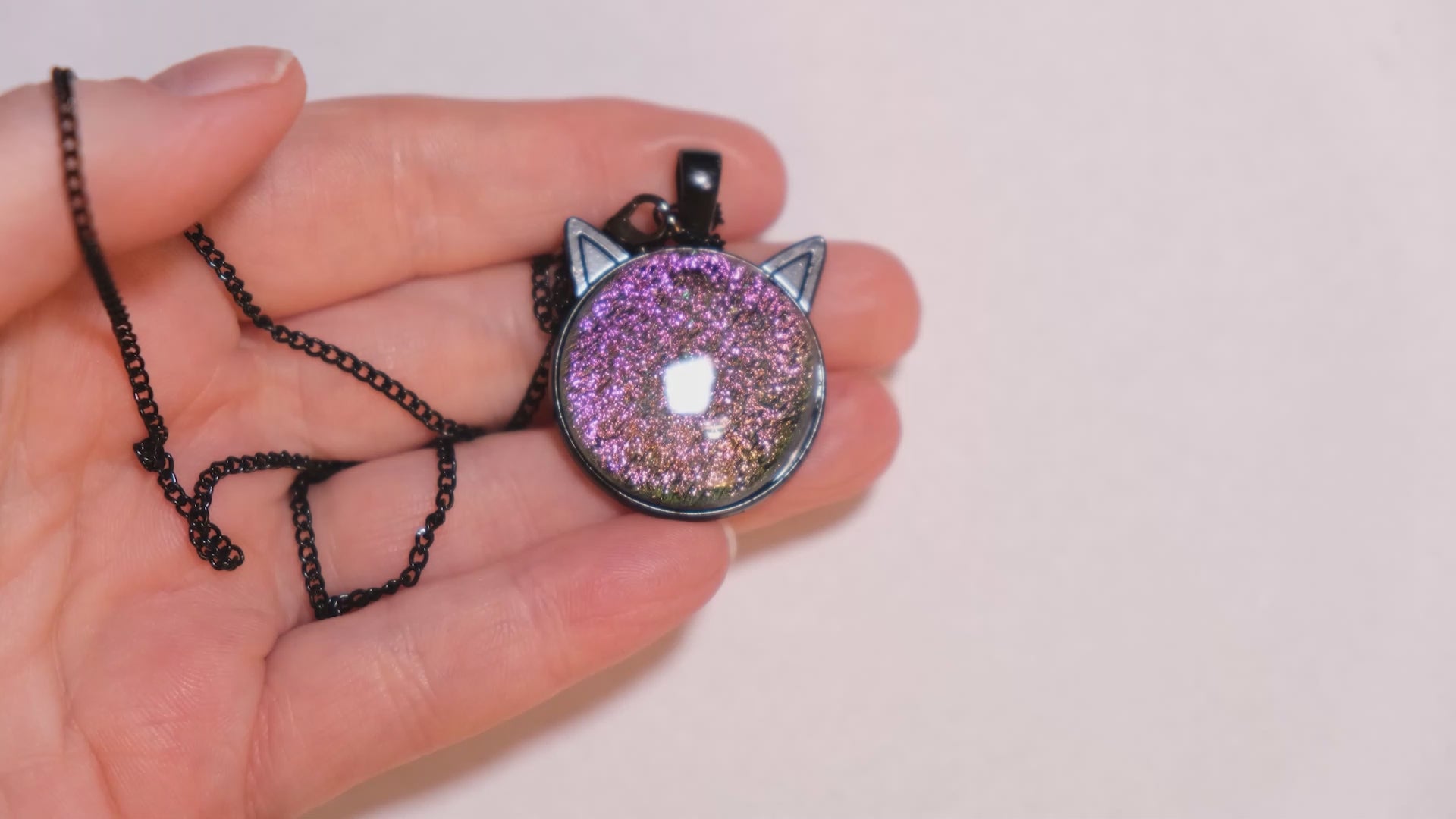 Magical Black Cat Pendant Necklace with pink/green Color-Shifting Dichroic Glass Center Stone on 20 in black chain seeds glassworks seedsglassworks