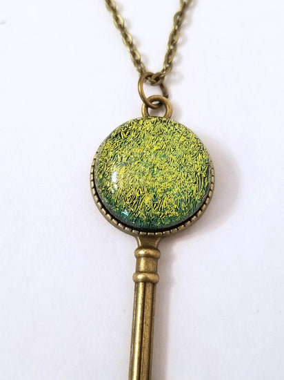 Antiqued Brass Small  Skeleton Key with Fused Glass Green Dichroic cabochon on 24 inch brass plated chain