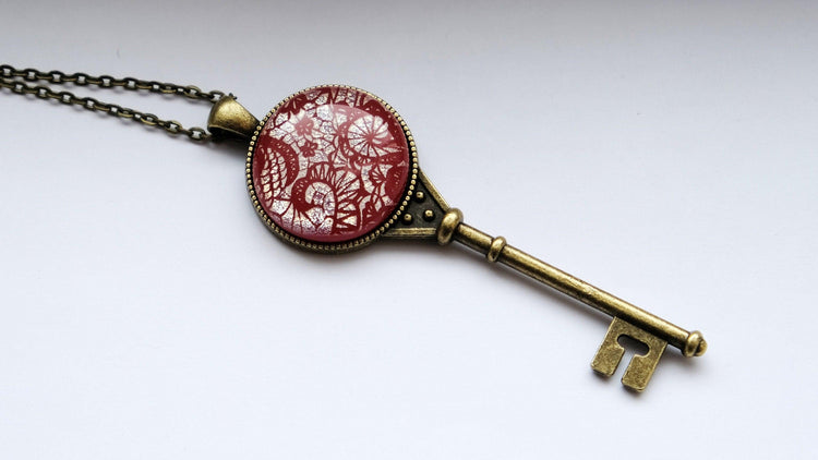 Antiqued Brass Skeleton Key pendant necklace with Fused Glass red lace Dichroic cabochon on 24 inch brass plated chain jewelry  steam punk and Victorian style seeds glassworks seedsglassworks